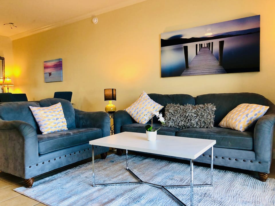 Very clean and spacious living room with a queen sofa bed