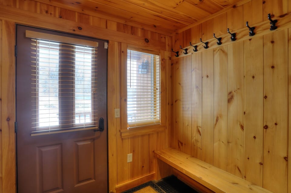 Entryway with plenty of hooks to store winter gear!