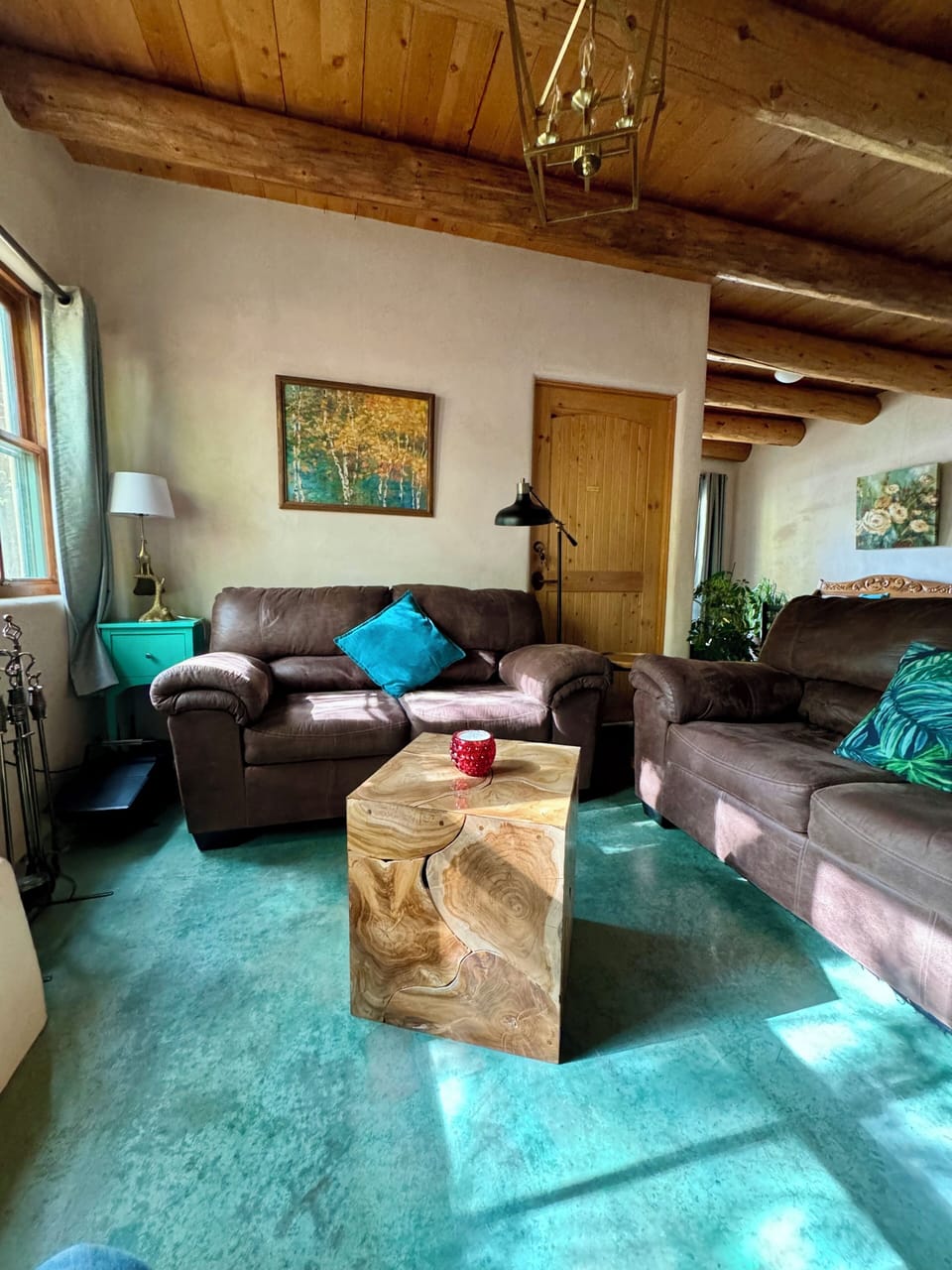 Living room area, comfy couches, big screen  Smart TV and a Kiva Fire Place.