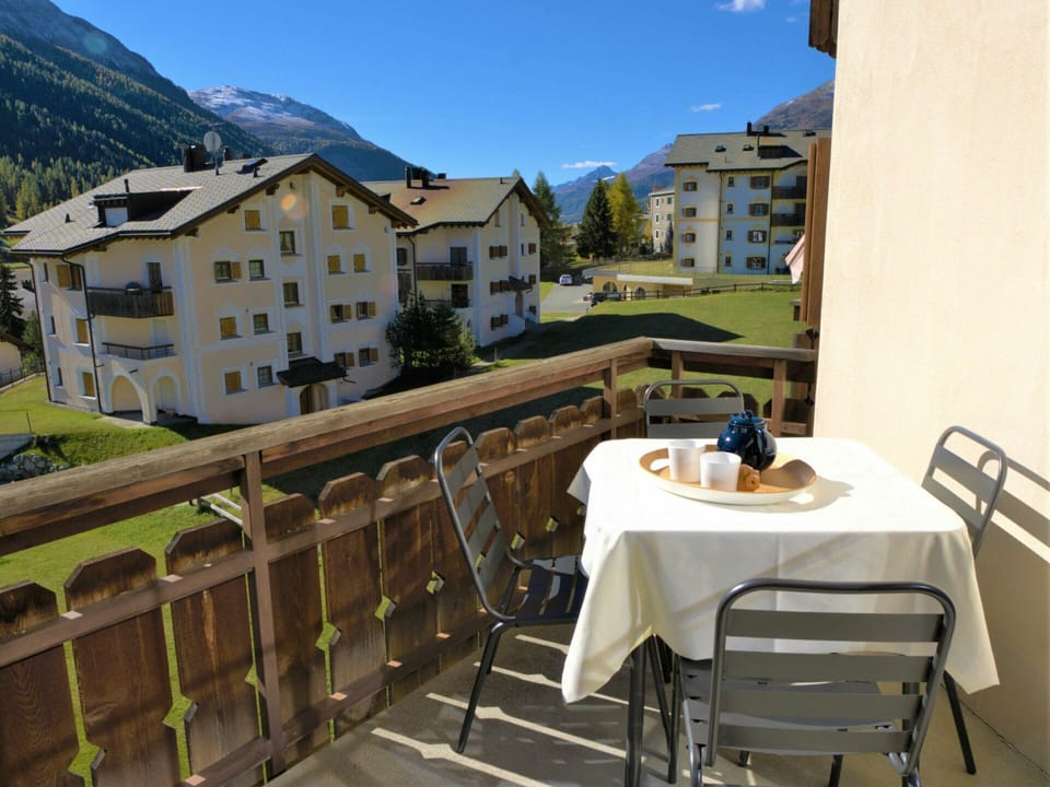 Sky, Building, Furniture, Table, Daytime, Property, Chair, Window, Mountain, Wood