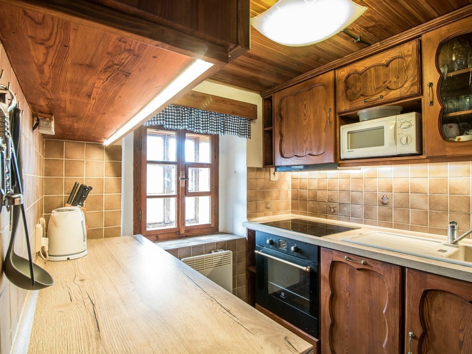 Cabinetry, Property, Countertop, Wood, Building, Kitchen Sink, Kitchen Stove, Kitchen Appliance, Lighting, Sink