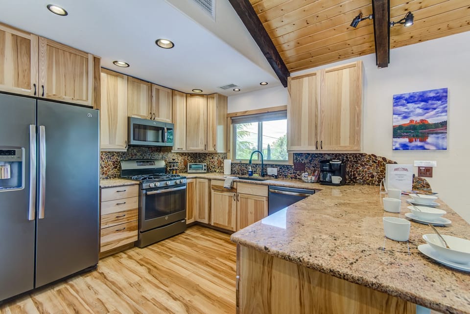 Updated Kitchen with Stone Counters and Stainless Steel Appliances