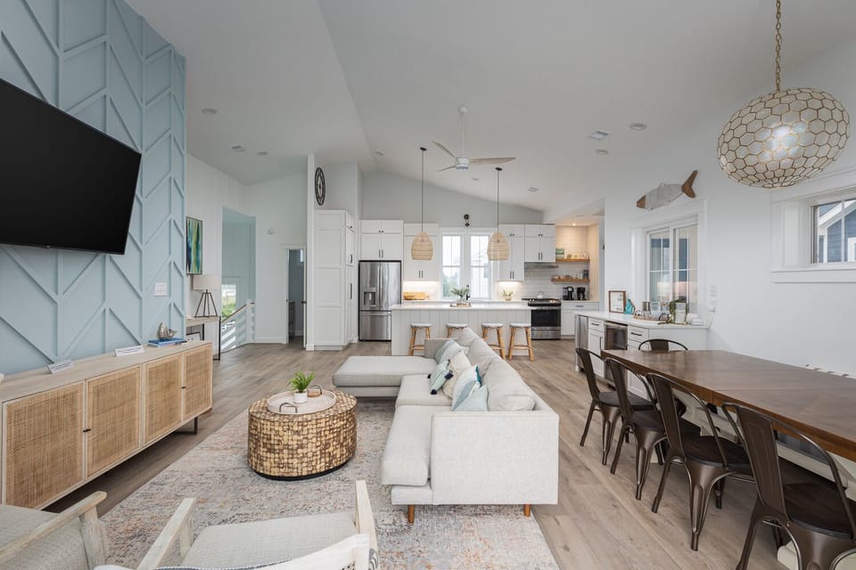Spacious living, dining and kitchen on top floor.
