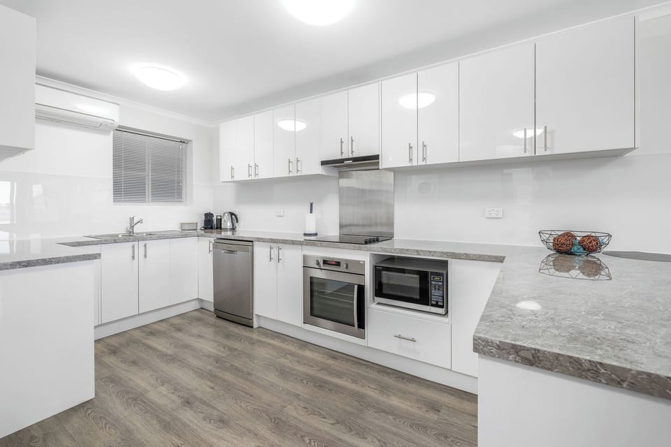 A fully appointed kitchen with full fridge/freezer, lots of cupboards, pantry and modern appliances