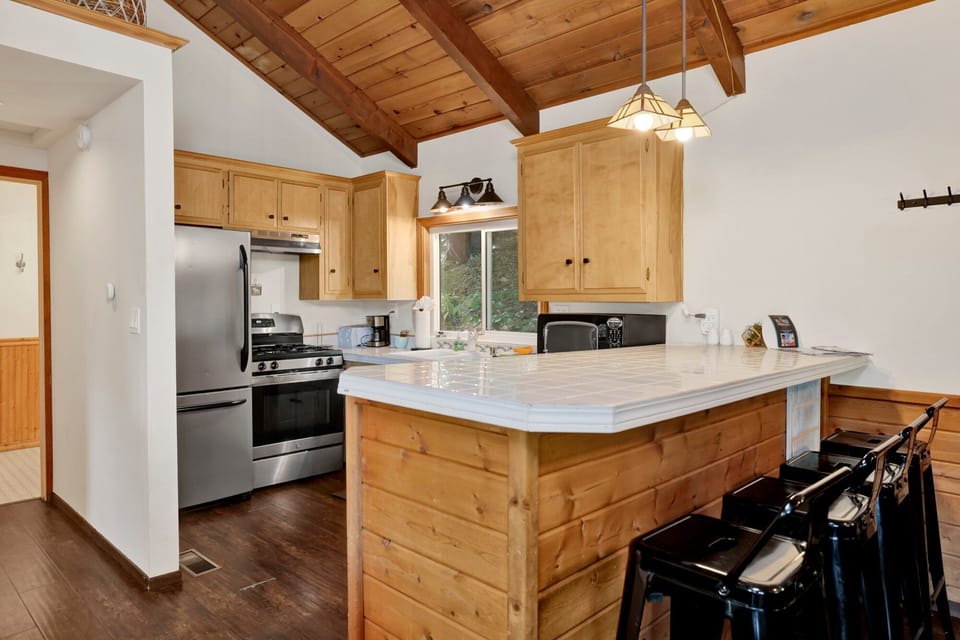 Spacious kitchen with modern appliances, ample counter space, and inviting design perfect for cooking and entertaining