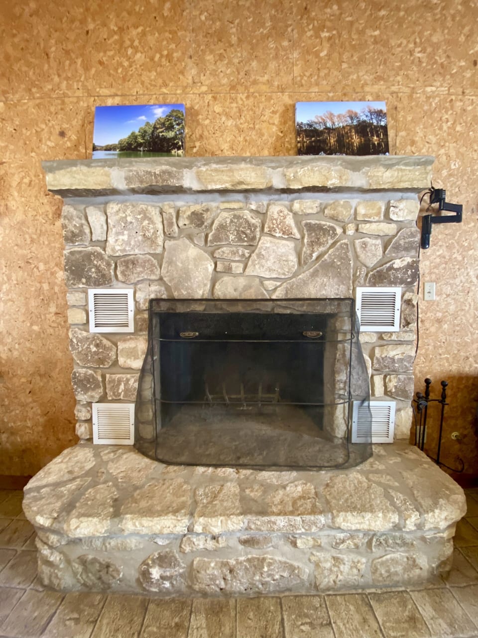 River Recess - Rock fireplace in living room.