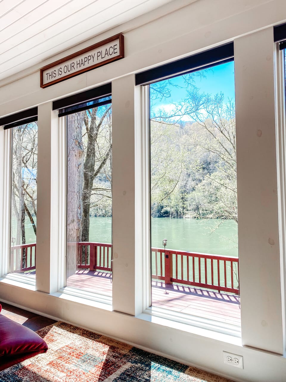 Our happy place - the enclosed sun room with a beautiful view of the river. 