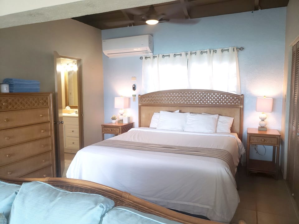King size bedroom opens to living area.