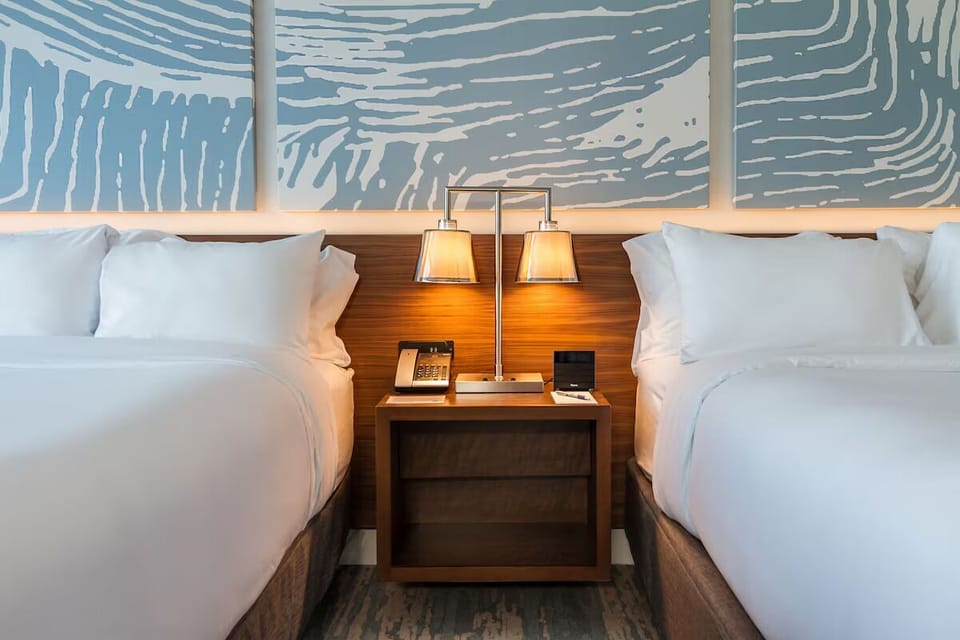 Drift off with soft bedside lighting and easy nightstand access.