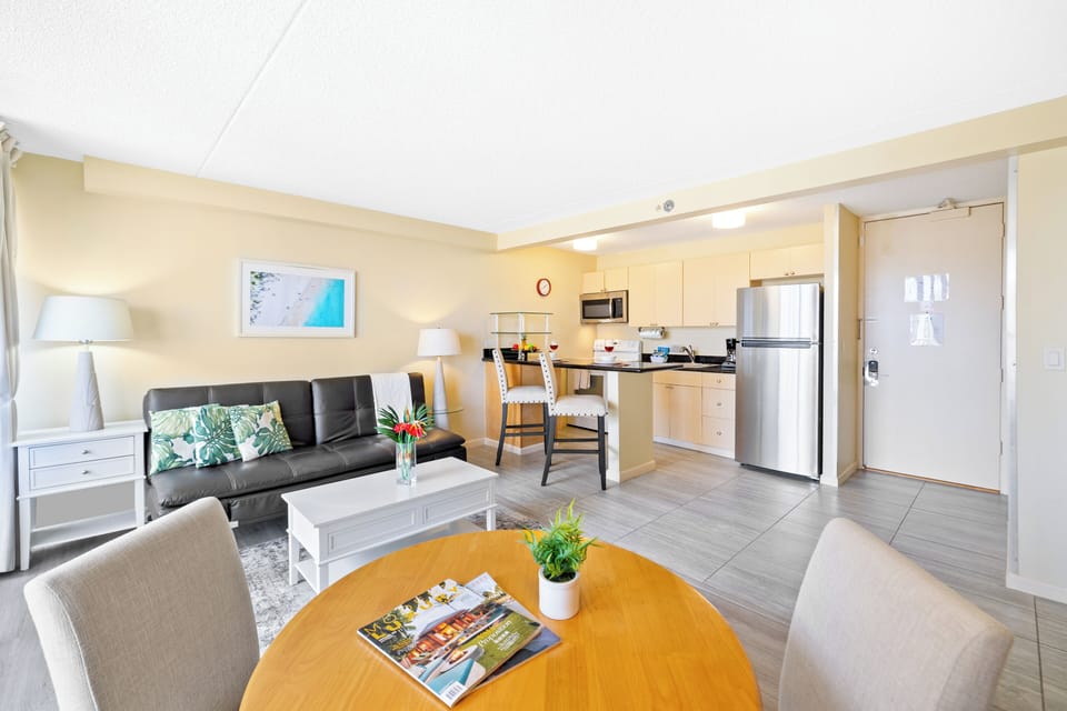 Seat comfortably in the living room while enjoying high-quality visuals from the 50-inch smart TV, and enjoy easy access to the dining table, kitchen, and balcony.
