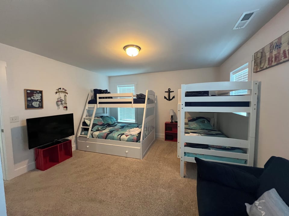 Bring your gaming system and use this dedicated TV with couch for relaxing!