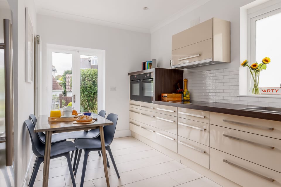 The kitchen offers access to our delightfully spacious garden.