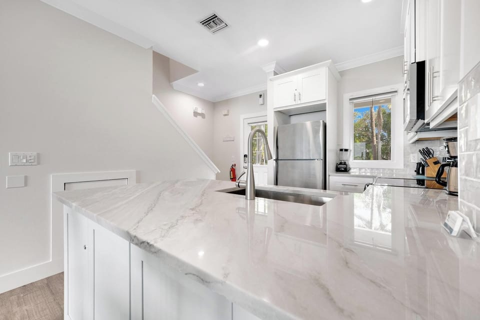 Newly updated kitchen with granite and vinyl waterproof flooring