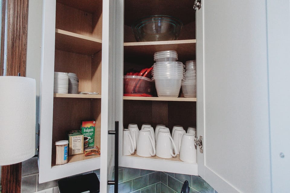 Coffee Cups. Food Storage. Mixing bowls. Help yourself cupboard.