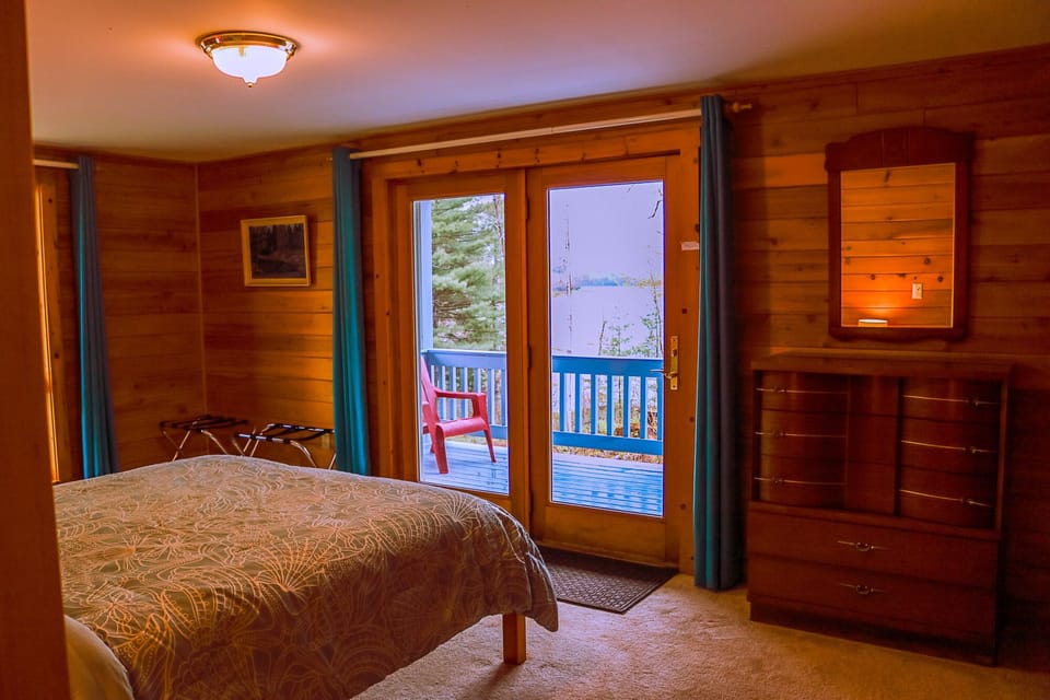 Expansive water views from bedroom, which exits directly onto porch
