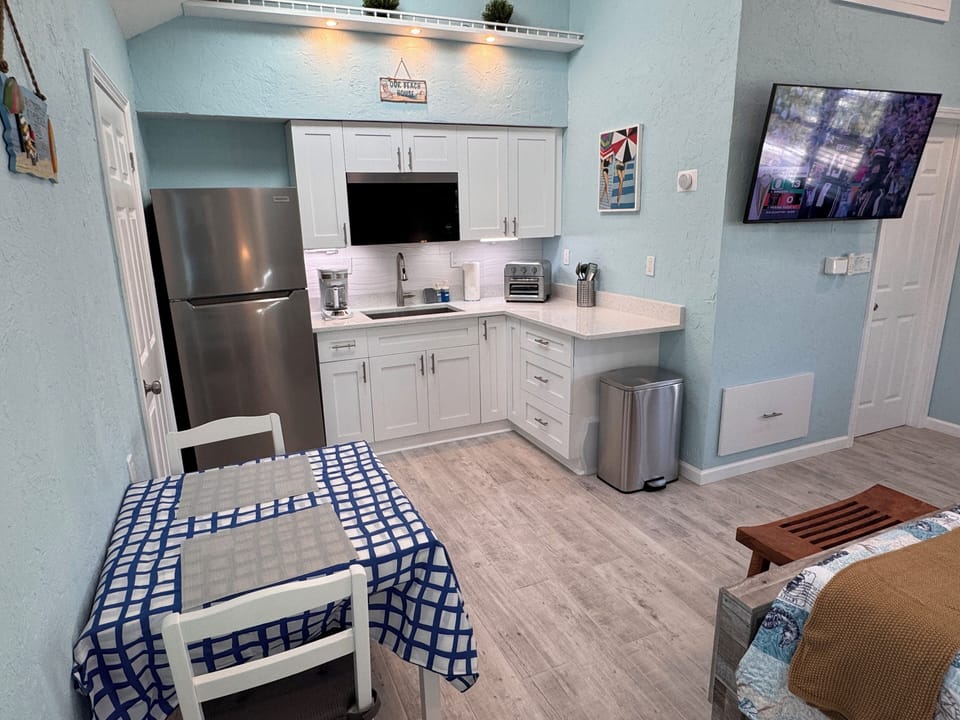 Brand new kitchen with a 2-burner cooktop, air fryer, and microwave.
