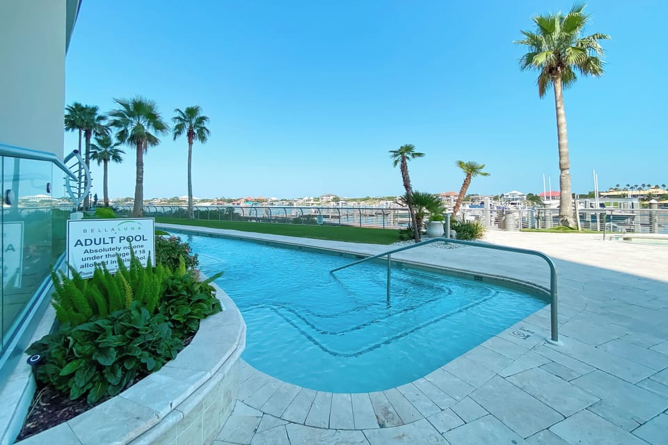 Experience undisturbed bliss. This inviting adult-only pool at Bella Luna provides a sophisticated and serene environment for residents to enjoy.
