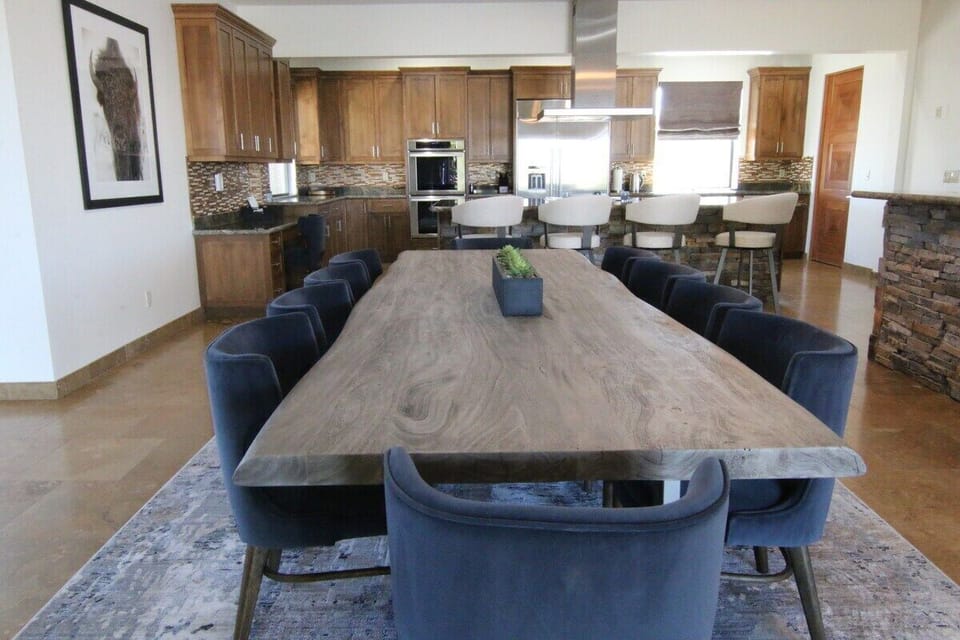 Dining table with 'FRANK'  looking in... He our baby bison in the photo.