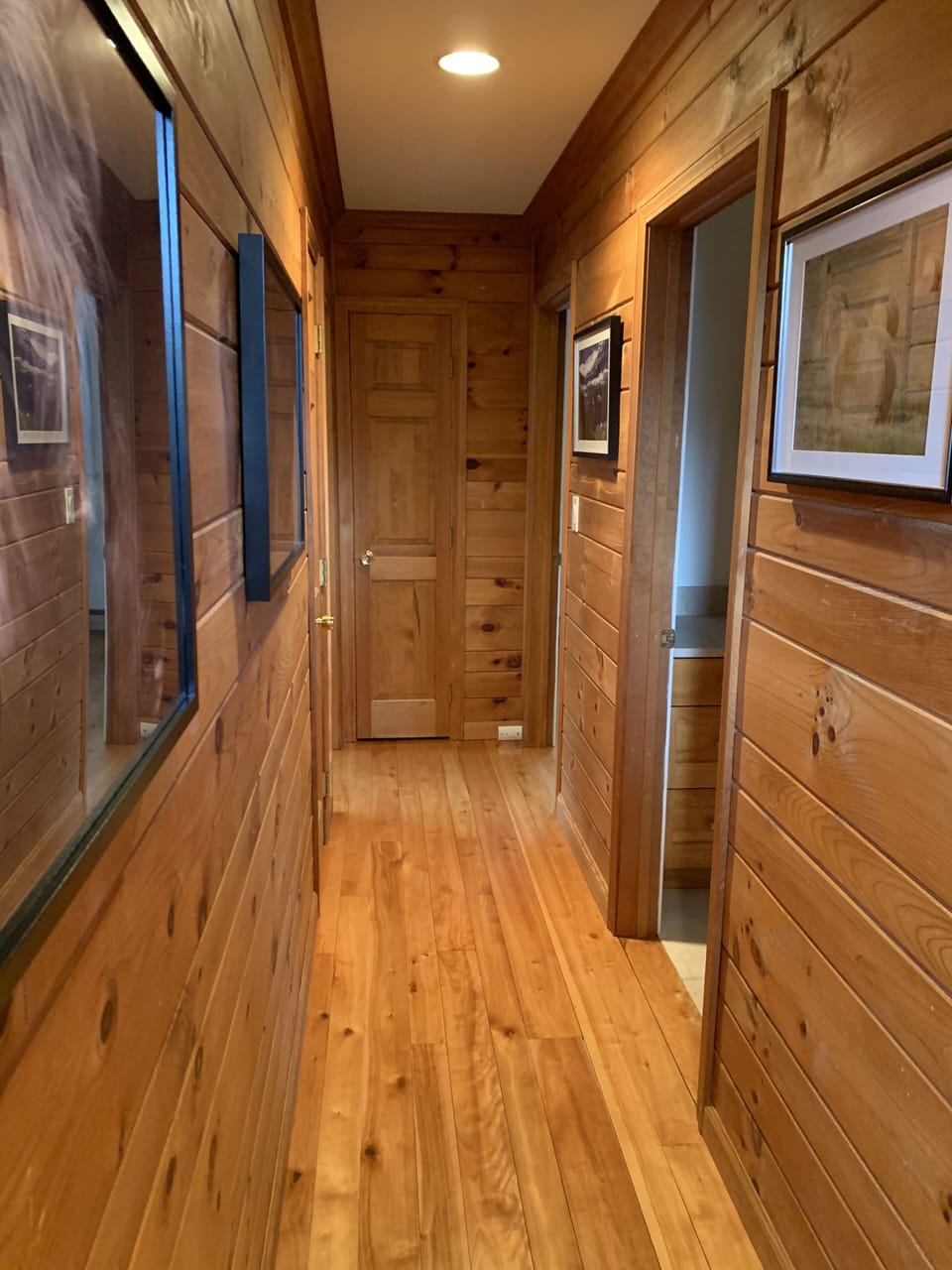 Hallway lined with photos from local Vermont photographers.
