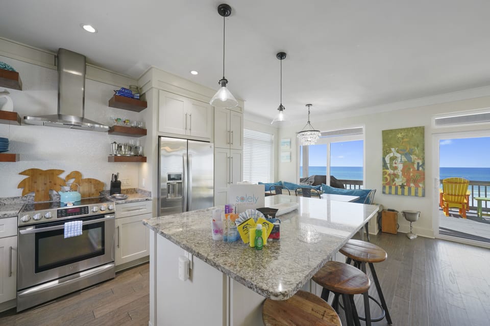 Full kitchen with 3 barstools