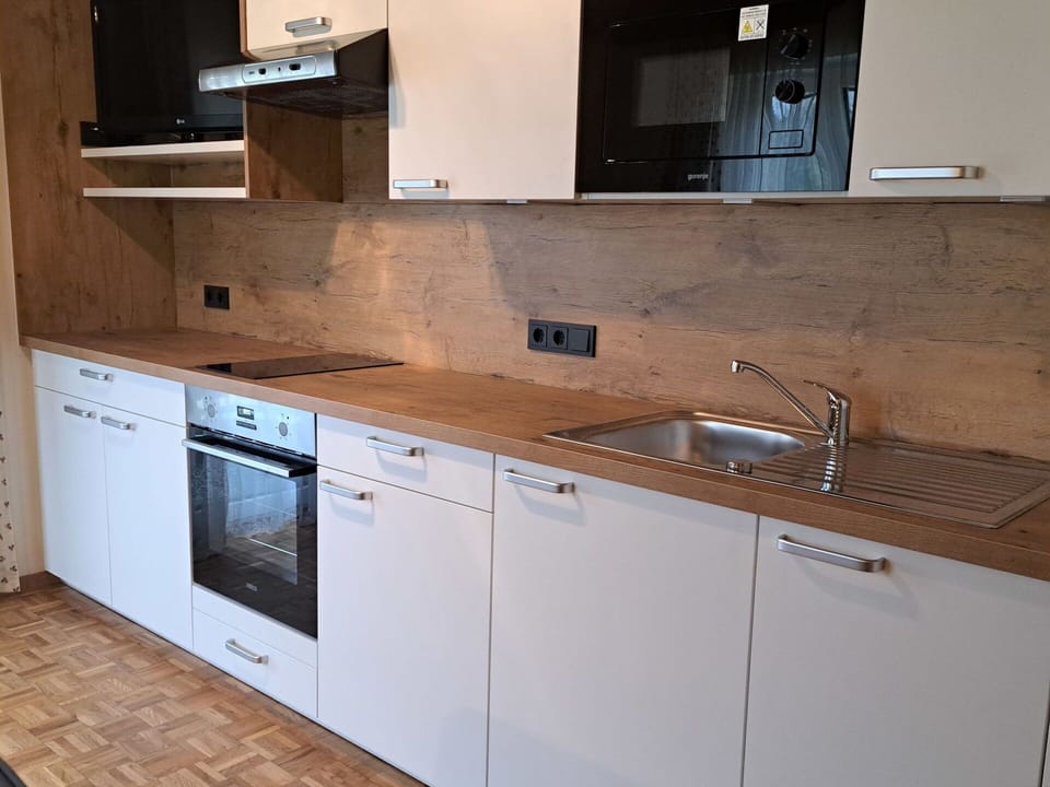 Brown, Countertop, Cabinetry, Tap, Kitchen Sink, Sink, Plumbing Fixture, Kitchen, Kitchen Stove, Wood