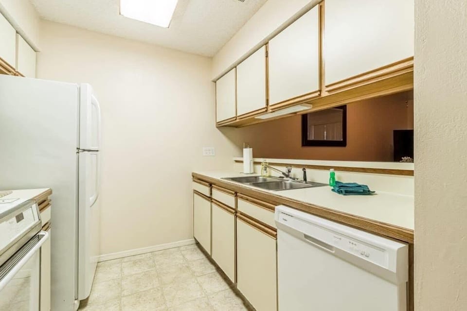 Kitchen overlooks Dining and Living Rooms.