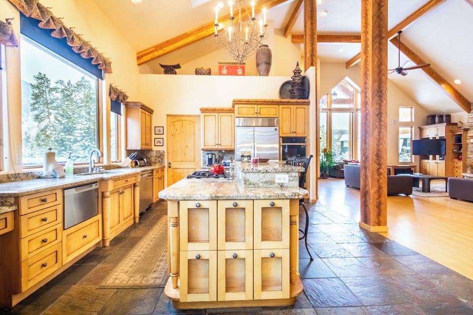 Your spacious gourmet kitchen awaits with granite countertops, modern appliances, and rustic charm perfect for creating memorable meals together.