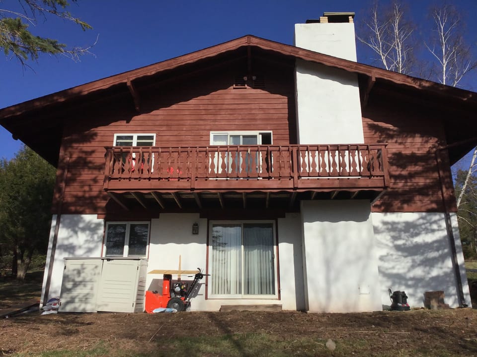 The side of the house.  Sleds are in the box. 