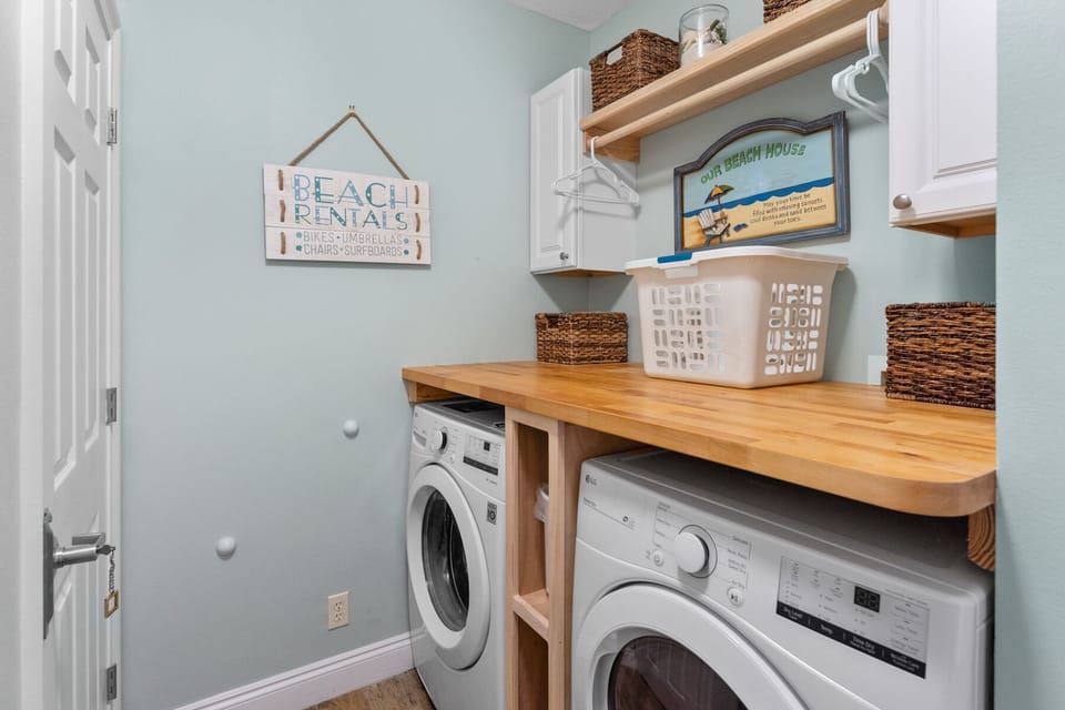 Your dedicated laundry room features a washer, dryer, and organized storage to keep your vacation wardrobe fresh throughout your stay.