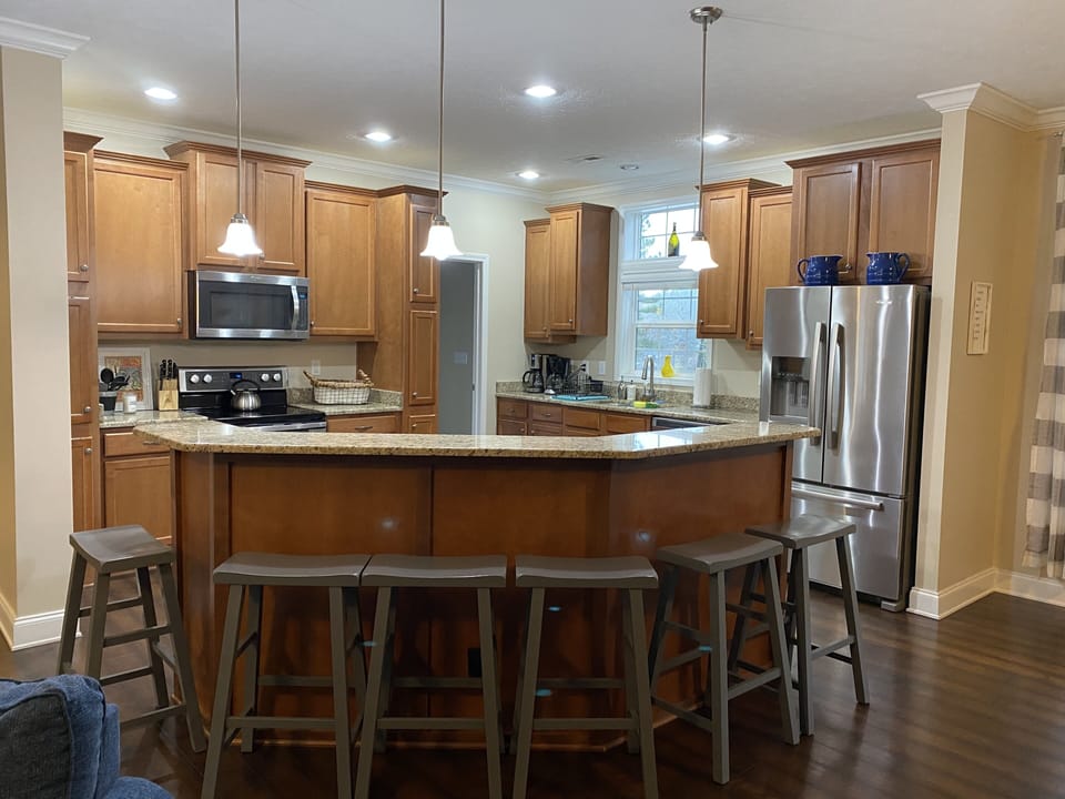 Kitchen has 2 refrigerators, one is in pantry behind kitchen