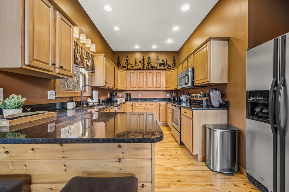 Bright, fully stocked kitchen with modern finishes. Perfect for cooking and gathering.