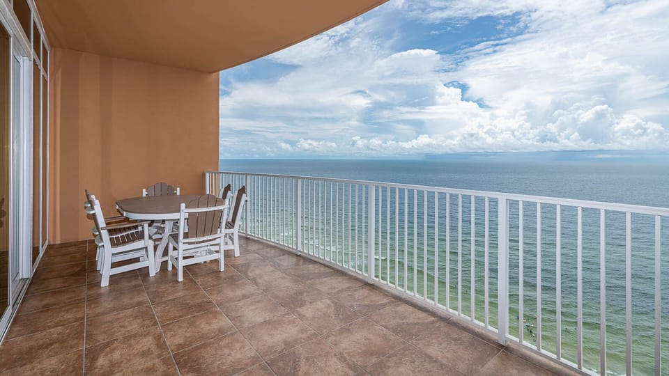 Savor your morning coffee at this balcony table while listening to the gentle sounds of the coast