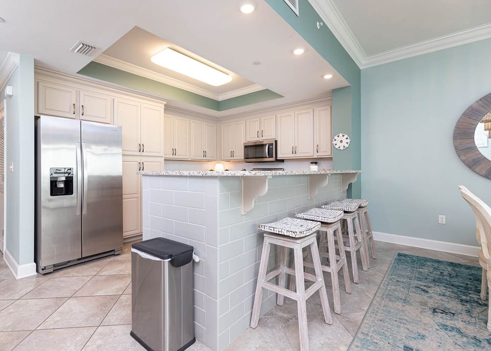 Gather with loved ones at the stylish breakfast bar, enjoying the open feel of the inviting kitchen