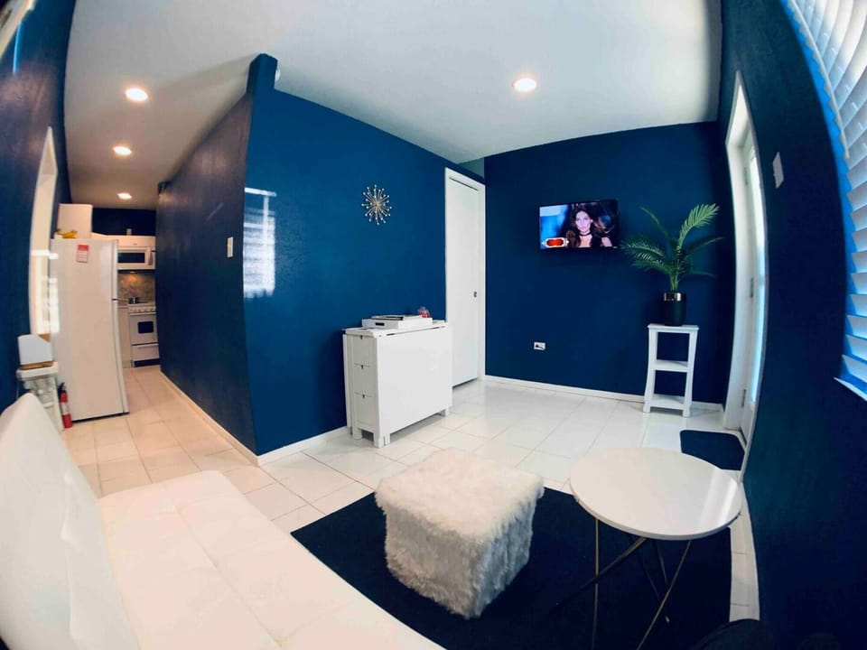 Living room, dining room, and kitchen area.