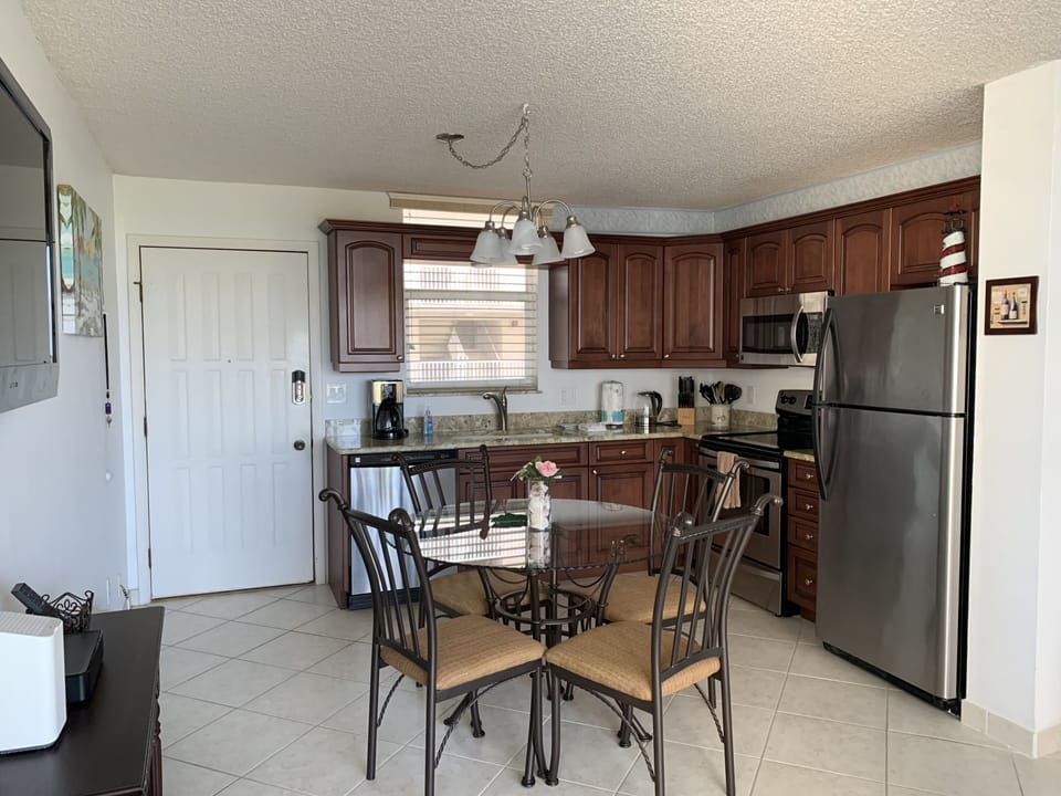 Recently updated kitchen with granite countertops, stainless steel appliances.