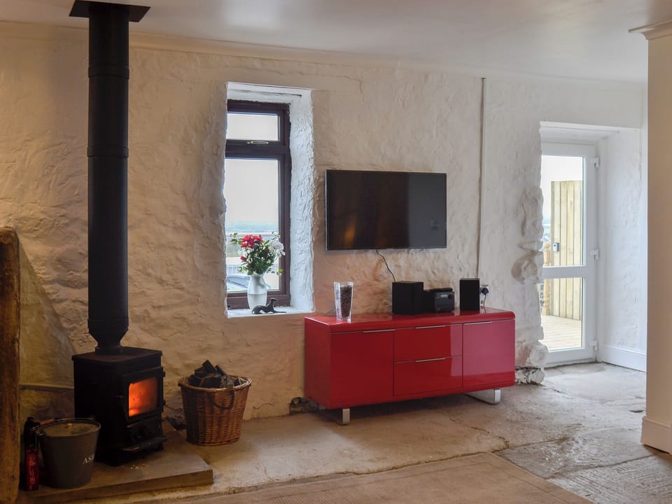 Contemporary kitchen area with traditional wood burner | The Calving Shed, Near Neilston