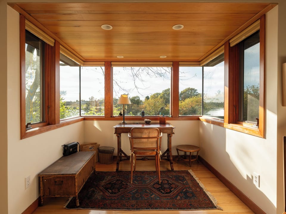 Desk nook in study with view to water on 3 sides