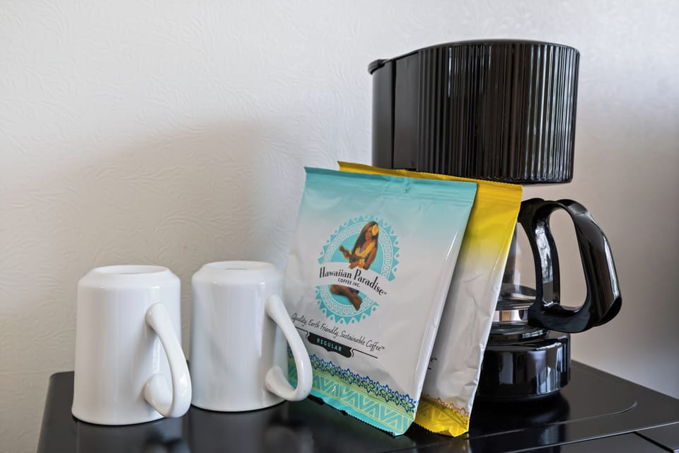 Start your mornings right with complimentary Hawaiian Paradise coffee and your own coffee maker, plus mugs ready for those perfect vacation moments.