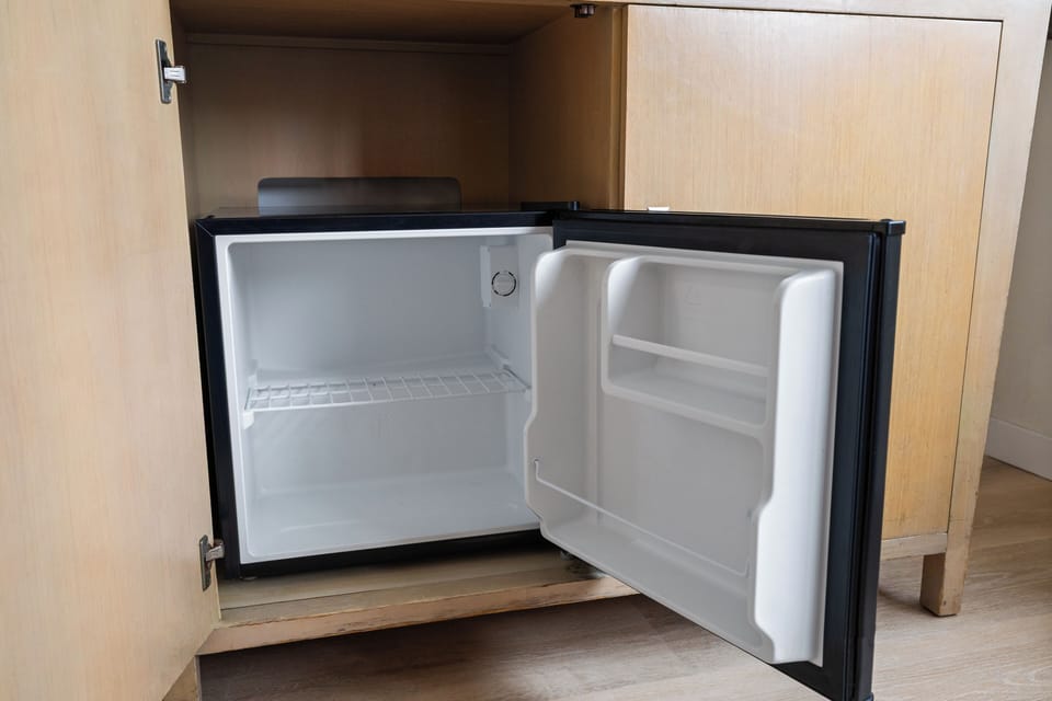 Keep your favorite snacks and drinks perfectly chilled in your private mini-fridge, conveniently tucked away in the cabinet.