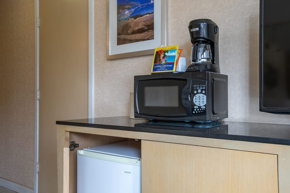 Your kitchenette comes equipped with a microwave, coffee maker, and mini-fridge—perfect for brewing your morning coffee or storing snacks during your stay.