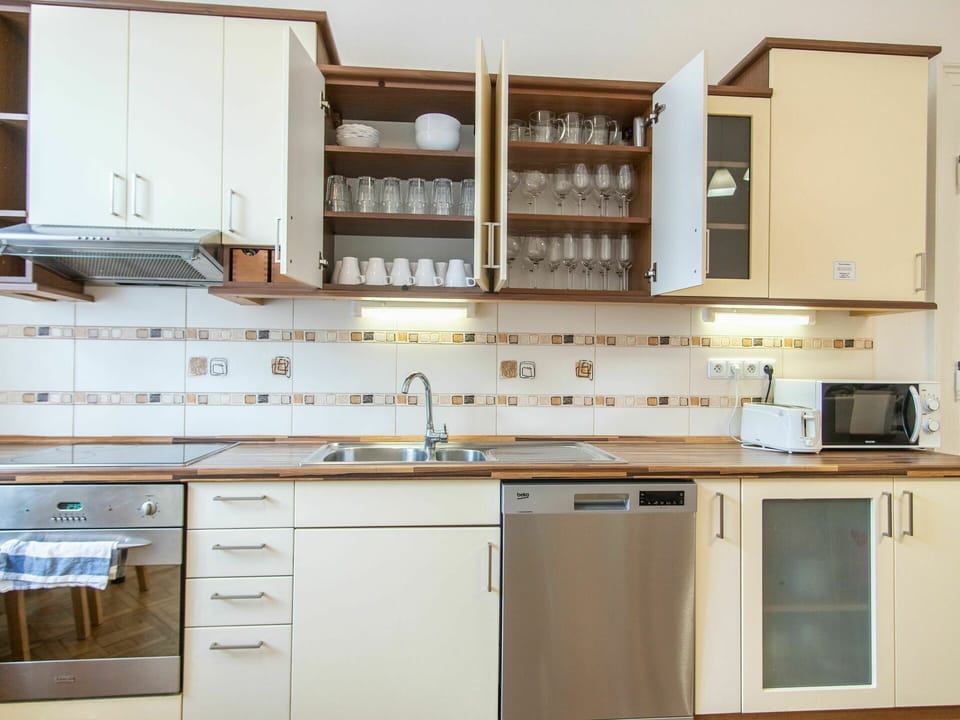 Cabinetry, Countertop, Property, Kitchen Sink, Building, Tap, Furniture, Sink, Kitchen Stove, Shelf