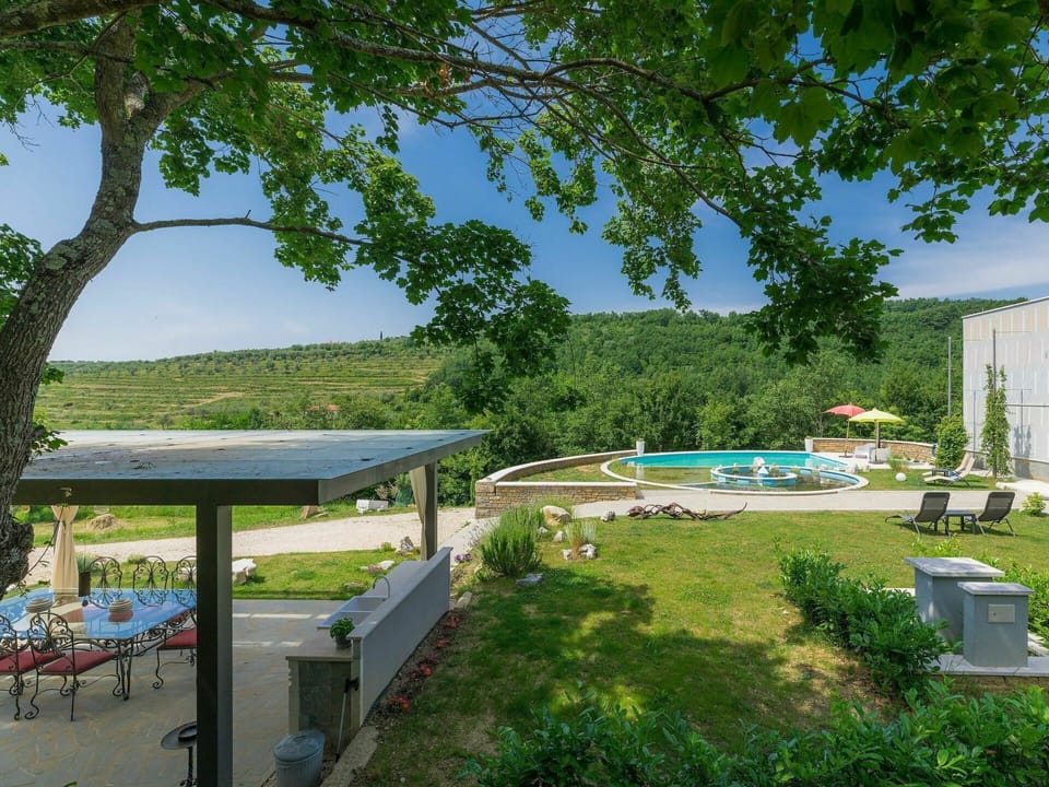 Plant, Sky, Property, Tree, Shade, Outdoor Furniture, Land Lot, Grass, Building, Leisure