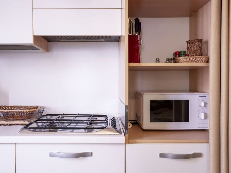 Property, Cabinetry, Furniture, Kitchen Appliance, Gas Stove, Kitchen Stove, Shelving, Interior Design, Wood, Kitchen