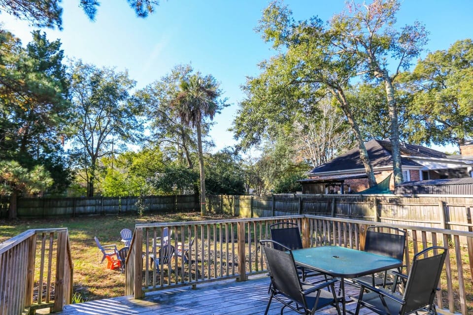 The deck overlooks the large, spacious yard.