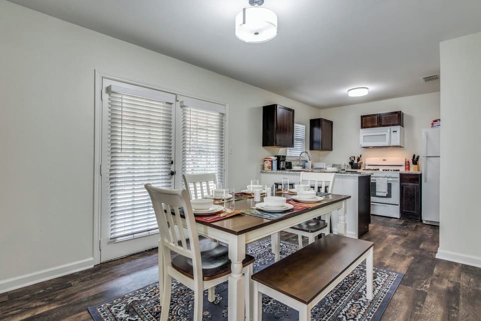 French doors lead out to the back yard/patio, you'll find the washer/dryer in the utility room on the left side of this patio