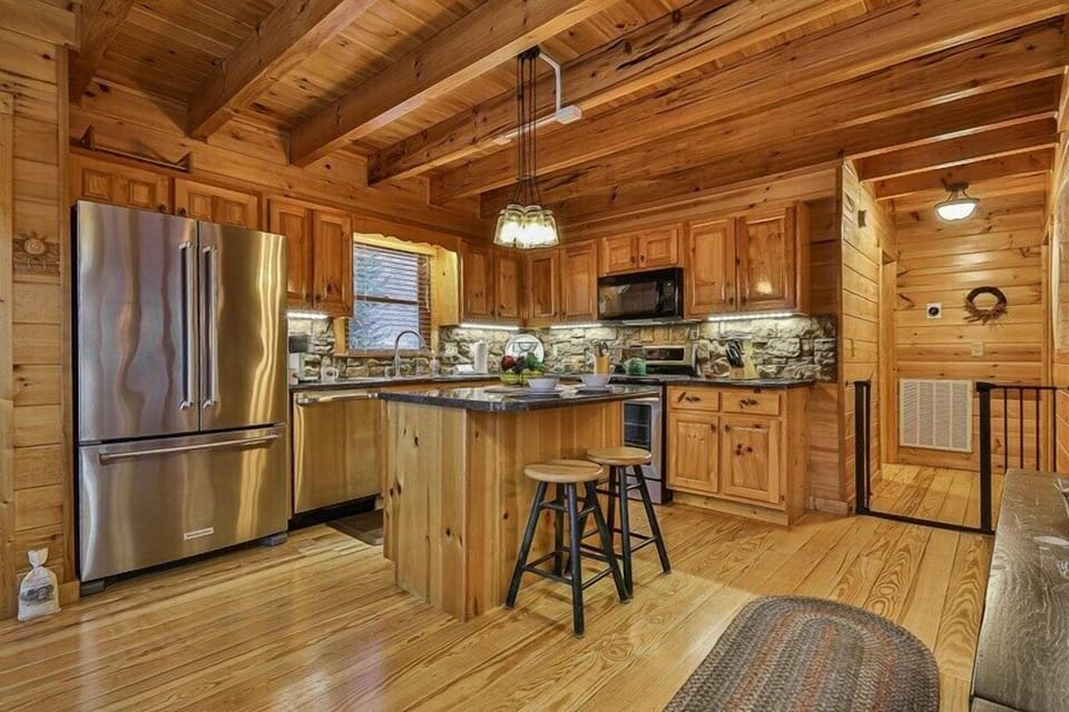Open Kitchen with Granite Counter Tops and Gas Range