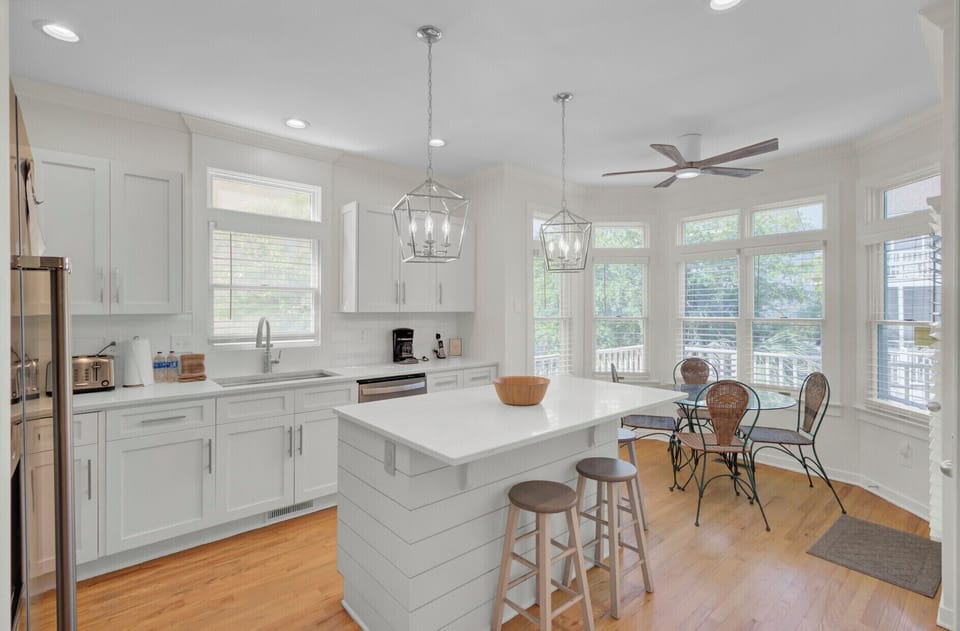 Gather in your bright, modern kitchen with island seating, perfect for morning coffee or casual meals together.