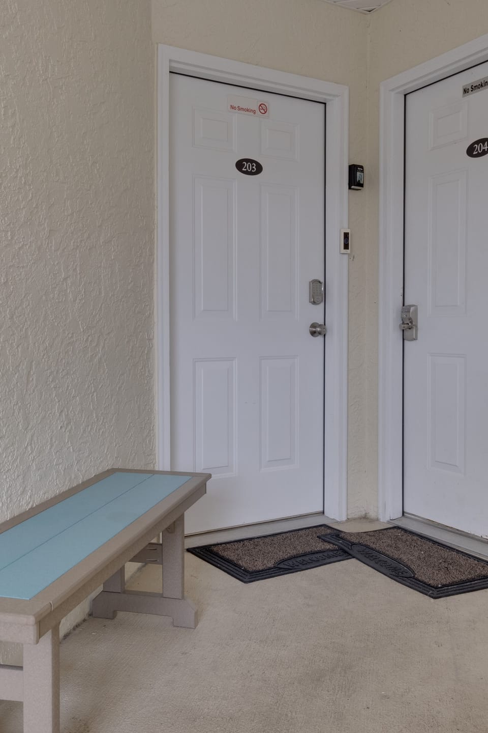Our condo on left with bench