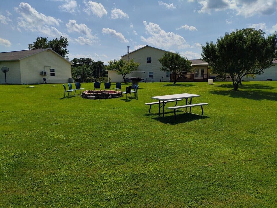 EXTERIOR:  The outdoor bonfire ring and picnic table.  Both are shared among all cabins.