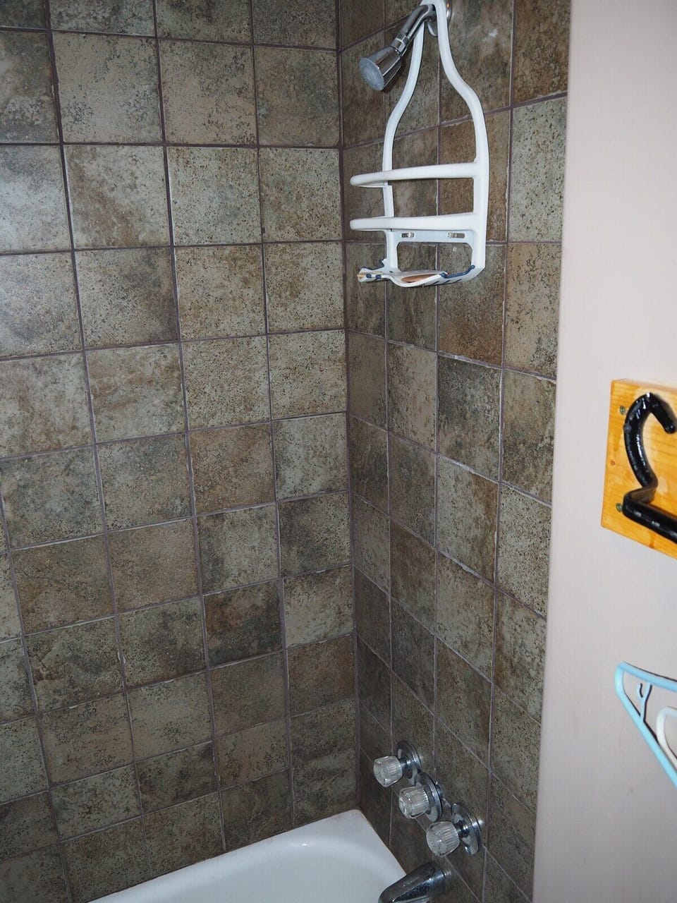 BATHROOM:  Includes combination tub / shower and toilet.  (Note that there is no vanity, sink, or mirror in the bathroom.)